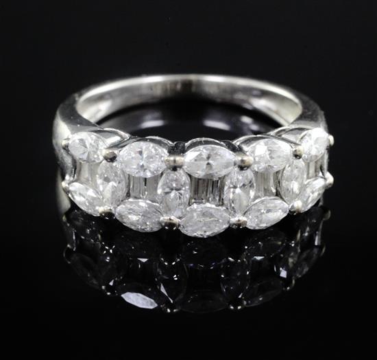 A modern 18ct white gold and graduated diamond cluster half hoop ring, size L.